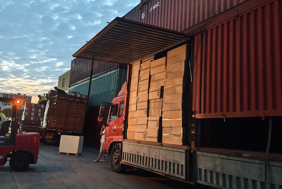 Container truck carrying export cargo at a freight terminal