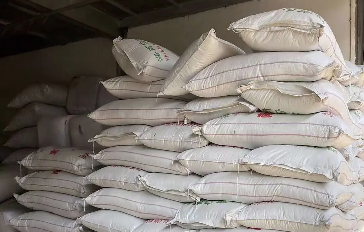 Stacked bagged pepper stock in a storage area